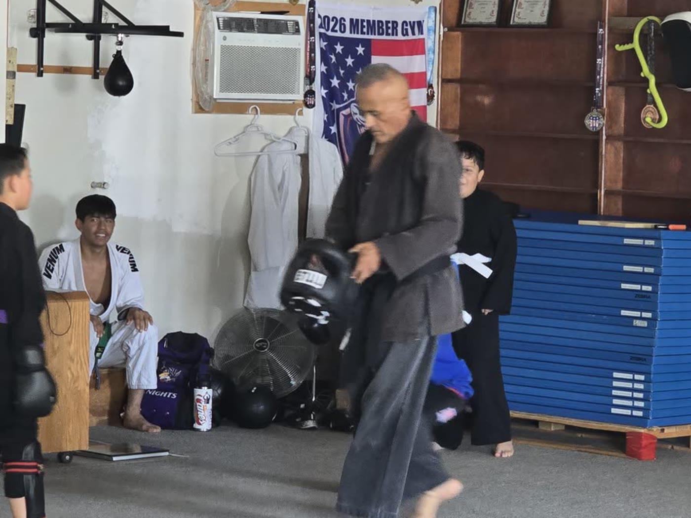 Instructor and students inside our Indio dojo
